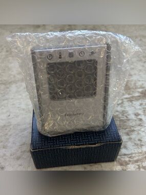 Brookstone 5-in-1 Sensor Travel Clock Time Temp Date Alarm Timer